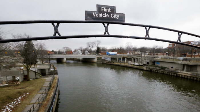 A sign over the Flint River in Flint, Mich. in January 2016.
