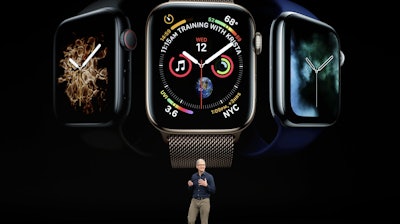 Apple CEO Tim Cook discusses the new Apple Watch 4 at the Steve Jobs Theater during an event to announce new products Wednesday, Sept. 12, 2018, in Cupertino, Calif.