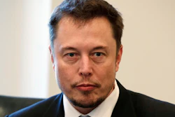 In this Dec. 14, 2016, file photo, Tesla CEO Elon Musk listens as President-elect Donald Trump speaks during a meeting with technology industry leaders at Trump Tower in New York.