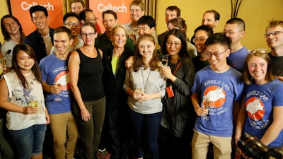 Nobel chemistry winner Frances Arnold, center, takes a photo with her Caltech Arnold Lab students at California Institute of Technology in Pasadena, Calif., Wednesday, Oct. 3, 2018.