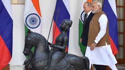 Indian Prime Minister Narendra Modi and Russian President Vladimir Putin arrive for a meeting in New Delhi, India, Friday, Oct. 5, 2018.