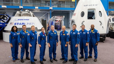This undated photo made available by NASA on Friday, Aug. 3, 2018 shows mockups of Boeing’s CST-100 Starliner and SpaceX’s Crew Dragon capsules at the Johnson Space Center in Texas.