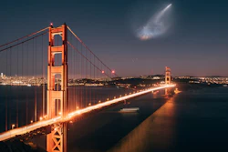In this photo taken Sunday, Oct. 7, 2018 and provided by Justin Borja, a SpaceX Falcon 9 rocket launch is seen in the distance over the Golden Gate Bridge near Sausalito, Calif.