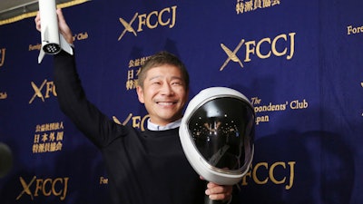 Zozo Chief Executive Yusaku Maezawa poses for the media prior to his news conference in Tokyo, Tuesday, Oct. 9, 2018.