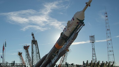 The Soyuz rocket is raised into a vertical position on the launch pad, Tuesday, Oct. 9, 2018 at the Baikonur Cosmodrome in Kazakhstan.