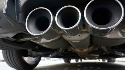 Exhaust pipes of a car are pictured in Berlin, Germany, Tuesday, Oct. 9, 2018.