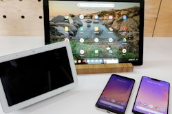 The Google Home Hub, left, Pixel Slate, center, and two new smartphones are displayed in New York, Tuesday, Oct. 9, 2018.
