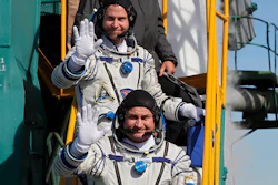 U.S. astronaut Nick Hague, right, and Russian cosmonaut Alexey Ovchinin, crew members of the mission to the International Space Station wave as they board the rocket prior to the launch of Soyuz-FG rocket at the Russian leased Baikonur cosmodrome, Kazakhstan, Thursday, Oct. 11, 2018.
