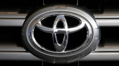 This Feb. 11, 2016, file photo shows a Toyota logo on the hood of a 2016 Toyota Sequoia on display at the Pittsburgh International Auto Show in Pittsburgh.