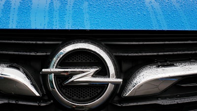 This Thursday, Nov. 9, 2017 file photo shows an Opel logo of an Opel Grandland at the Opel headquarters in Ruesselsheim, Germany.