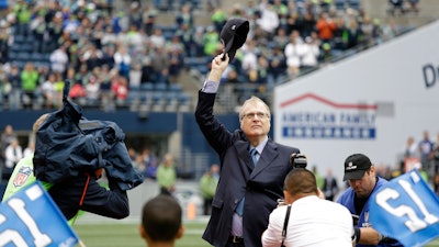 In this Sept. 17, 2017 photo, Seattle Seahawks owner Paul Allen waves as he is honored for his 20 years of team ownership.