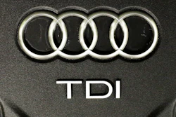 This Sept. 28, 2015 file photo shows the sign of German car company Audi attached on the engine of a TDI, a turbo diesel model, in Berlin.