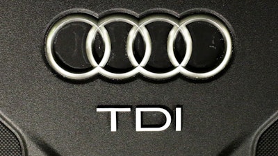 This Sept. 28, 2015 file photo shows the sign of German car company Audi attached on the engine of a TDI, a turbo diesel model, in Berlin.