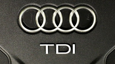 This Sept. 28, 2015 file photo shows the sign of German car company Audi attached on the engine of a TDI, a turbo diesel model, in Berlin.