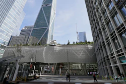 In this Sept. 27, 2018, file photo, a few people walk through main plaza entryway to the closed Salesforce Transit Center in San Francisco.