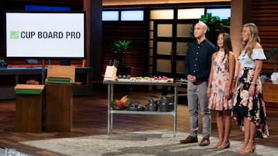 In this image provided by ABC, Kevin Young’s children present the product of their late father on a 'Shark Tank' episode that aired on Sunday, Oct. 21, 2018.