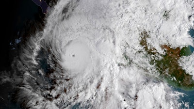 This GOES East satellite image provided by NOAA shows Hurricane Willa in the eastern Pacific, on a path toward Mexico's Pacific coast on Monday, Oct. 22, 2018.