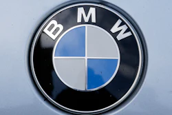 In this Aug. 1, 2017 file photo the brand logo of German car maker BMW is photographed on a car in Berlin.
