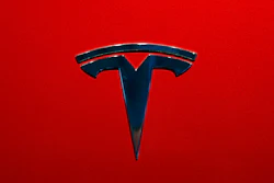 This Oct. 3, 2018, file photo shows the logo of Tesla model 3 at the Auto show in Paris.