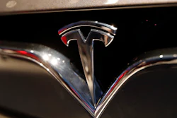 This Oct. 3, 2018, file photo shows a Tesla emblem at the Auto show in Paris.