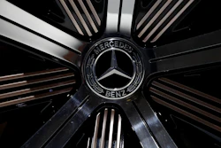 In this Feb. 2, 2017 file photo the logo of Mercedes-Benz E-Class Coupe is photographed prior to the annual balance news conference at the company's headquarters in Stuttgart, Germany.