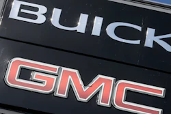 In this April 25, 2017, file photo, a General Motors dealer's sign stands in Nashville, Tenn.