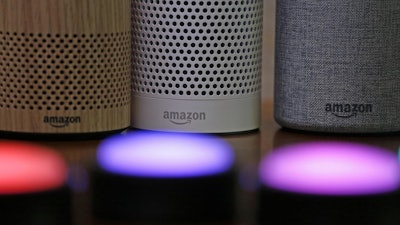 Amazon Echo, Echo Plus and Echo Button devices are shown during an event announcing several new Amazon products in Seattle on Sept. 27, 2017.