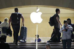 Travelers pass the Apple Store at New York’s Grand Central Terminal.