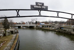 A sign over the Flint River in Flint, Mich. in January 2016.