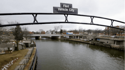 A sign over the Flint River in Flint, Mich. in January 2016.