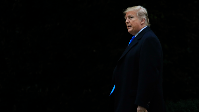 In this Oct. 26, 2018, file photo President Donald Trump walks from the Oval Office as he leaves the White House in Washington to attend a campaign rally in Charlotte, N.C.