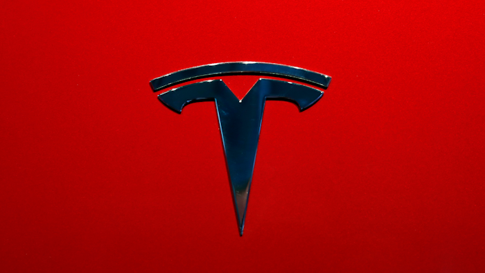 This Oct. 3, 2018, file photo shows the logo of Tesla Model 3 at the Auto show in Paris.