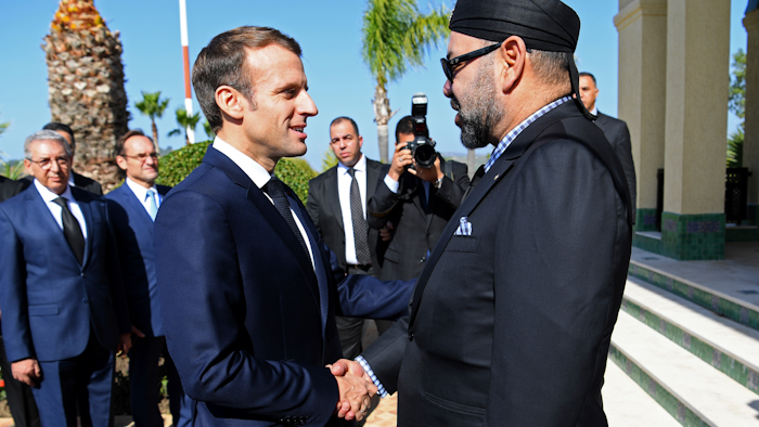 French President Emmanuel Macron, left, is welcomed by Moroccan King Mohammed VI at Tangiers' airport, Morocco, Thursday, Nov. 15, 2018.
