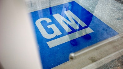 In this Jan. 10, 2013, file photo, the logo for General Motors decorates the entrance at the site of a GM information technology center in Roswell, Ga.