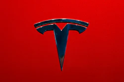 This Oct. 3, 2018, file photo shows the logo of Tesla Model 3 at the Auto show in Paris.