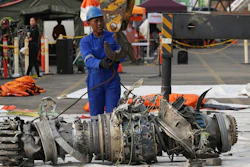 Officials move an engine recovered from the crashed Lion Air jet for further investigation in Jakarta, Indonesia, Sunday, Nov. 4, 2018.