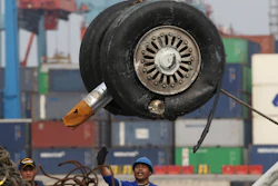In this Saturday, Nov. 3, 2018, file photo, a crane moves a pair of wheels recovered from the Lion Air jet that crashed into the Java Sea for further investigation at Tanjung Priok Port in Jakarta.