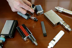 In this Tuesday, April 10, 2018, file photo, a high school principal displays vaping devices confiscated from students.