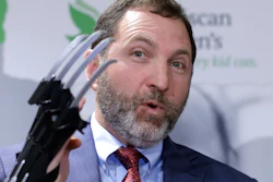 James Swartz, director of W.A.T.C.H., displays a Black Panther 'slash claw' as he introduces toys topping the group's annual list of worst toys for the holiday season.