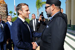 French President Emmanuel Macron, left, is welcomed by Moroccan King Mohammed VI at Tangiers' airport, Morocco, Thursday, Nov. 15, 2018.