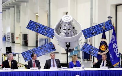 European Space Agency director general Jan Worner, far right, answers questions during a panel discussion with U.S. and European leaders.