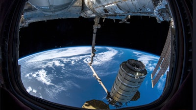 In this image provided by NASA, a commercial shipment arrives at the International Space Station on Monday, Nov. 19, 2018.