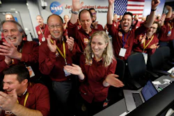 Engineers celebrate as the InSight lander touch downs on Mars at NASA's Jet Propulsion Laboratory.