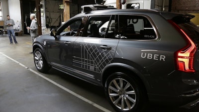 In this Tuesday, Dec. 13, 2016, file photo, an Uber driverless car is displayed in a garage in San Francisco.