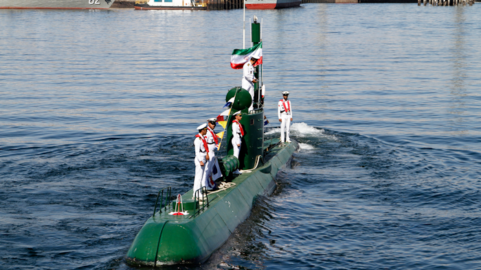 In this photo provided by the semiofficial Mehr News Agency, Iran's navy members stand on Ghadir-942 submarine in southern port of Bandar Abbas, Iran.