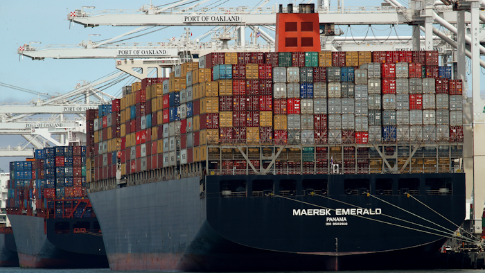 In this Thursday, July 12, 2018, file photo, the container ship Maersk Emerald is unloaded at the Port of Oakland, Calif.