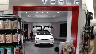 A Tesla Model X vehicle is shown at a gallery showroom in the Nordstrom department store in Troy, Mich., in 2016.