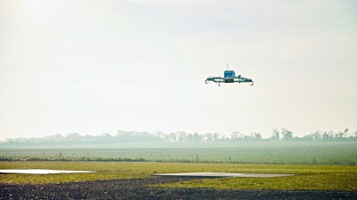 This Dec. 7, 2016, file photo provided by Amazon shows an Amazon Prime Air drone in Cambridgeshire, U.K.