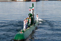 In this photo provided by the semiofficial Mehr News Agency, Iran's navy members stand on Ghadir-942 submarine in southern port of Bandar Abbas, Iran.