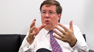 In this Jan. 11, 2016, file photo, Toyota North America CEO Jim Lentz speaks during an interview at the North American International Auto Show in Detroit.